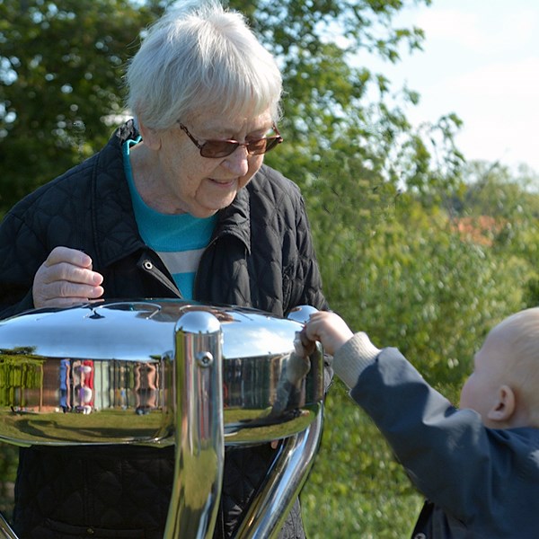 Babel Drum (Large) Older lady playing with younger child (600x600 Babel Drum