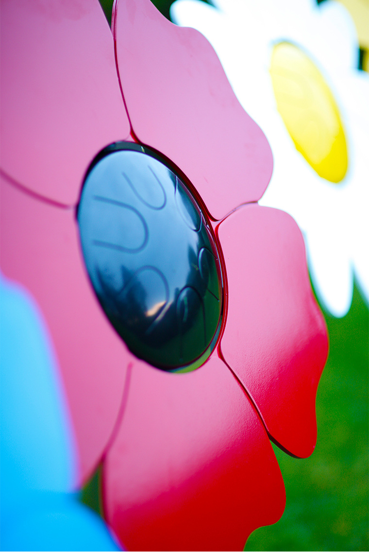 an outdoor musical drum in the shape and colours of a poppy