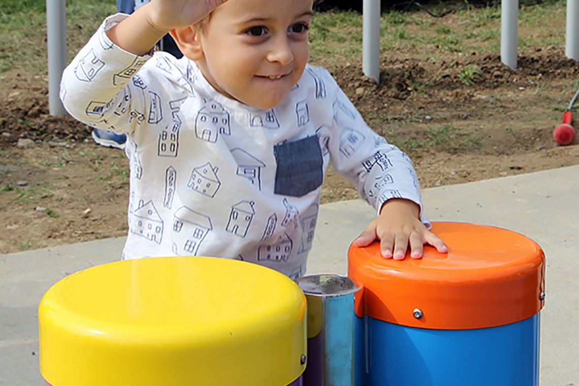 Boys Playing Outdoor Musical Drums